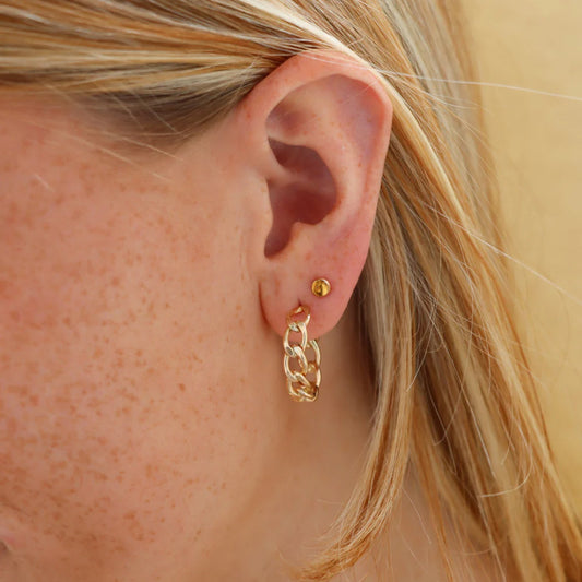 Alex chain hoops in gold on models ear