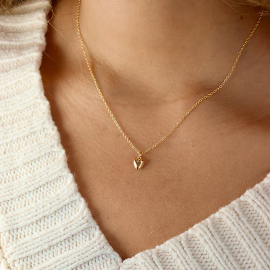 Gold everthine necklace on model