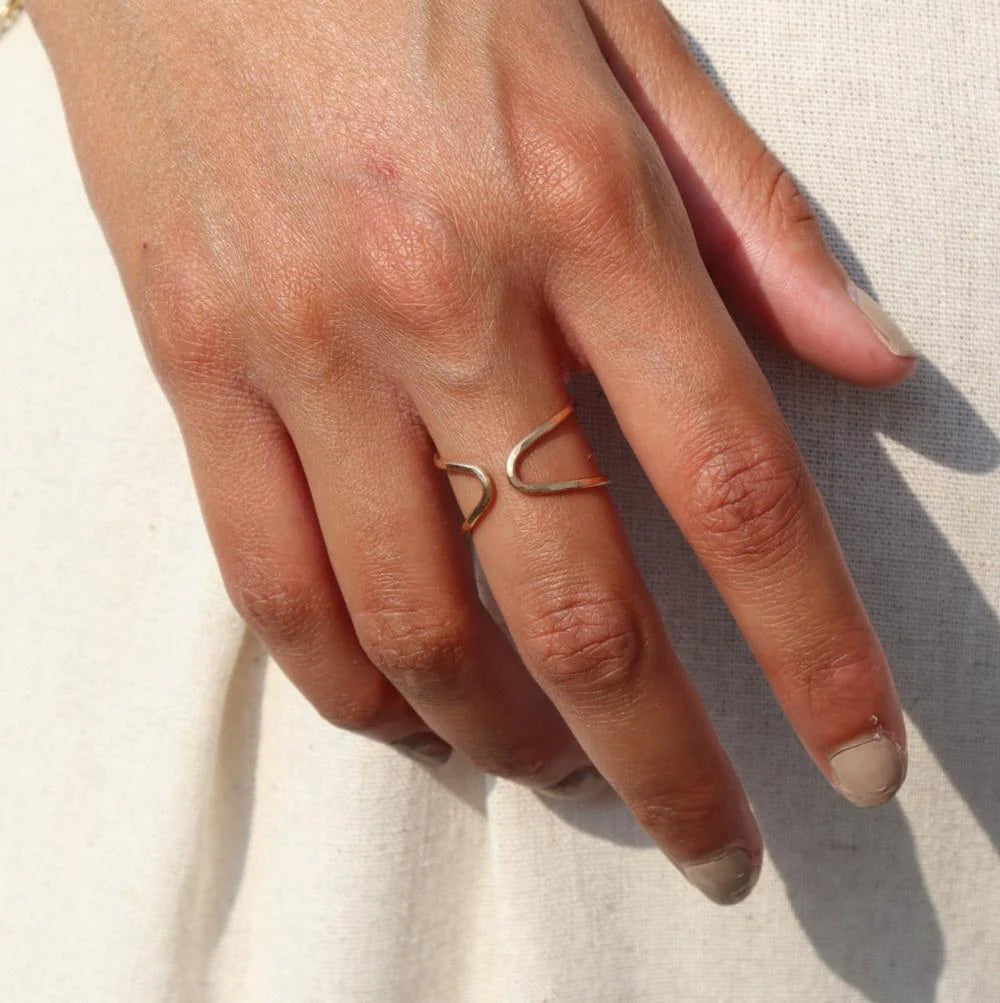 Gold sundari ring on models hand