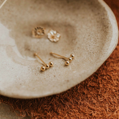 Gold triple dot studs 