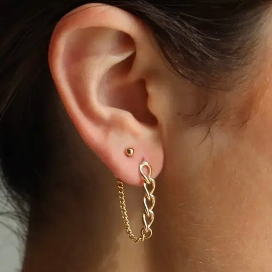 Gold alex chain earrings in models ear